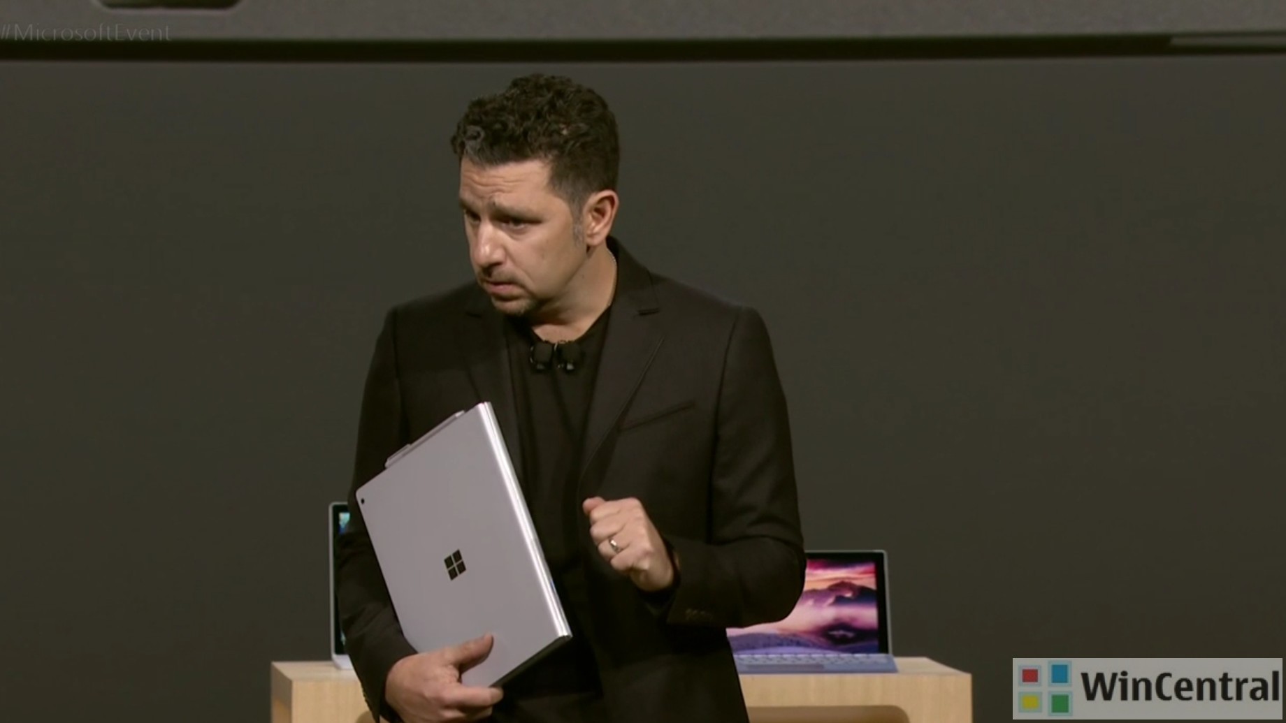 Panos Panay holding a Surface device